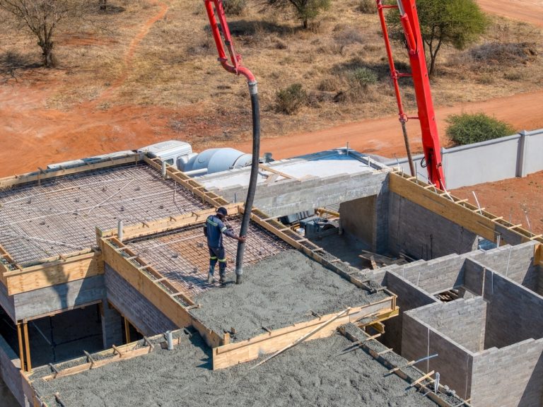 construction site using a boom concrete pump