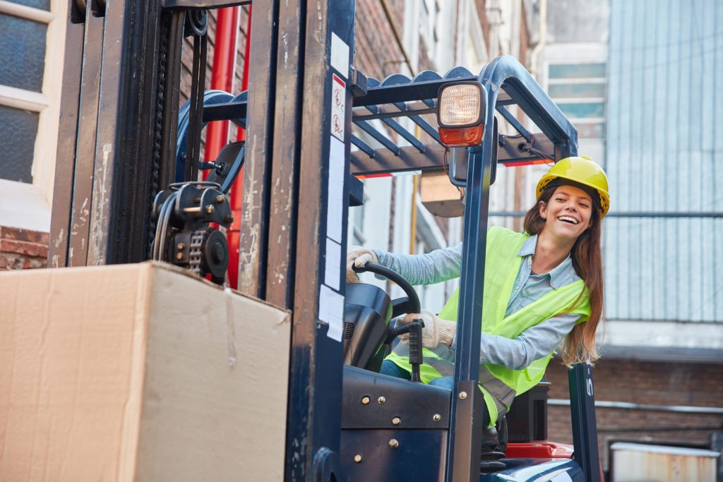 Woman driving a fork lift
