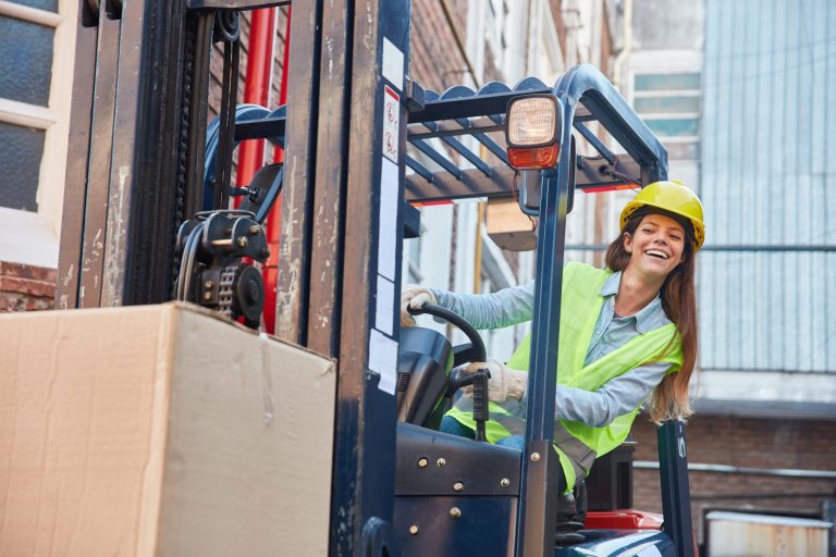 Woman driving a fork lift